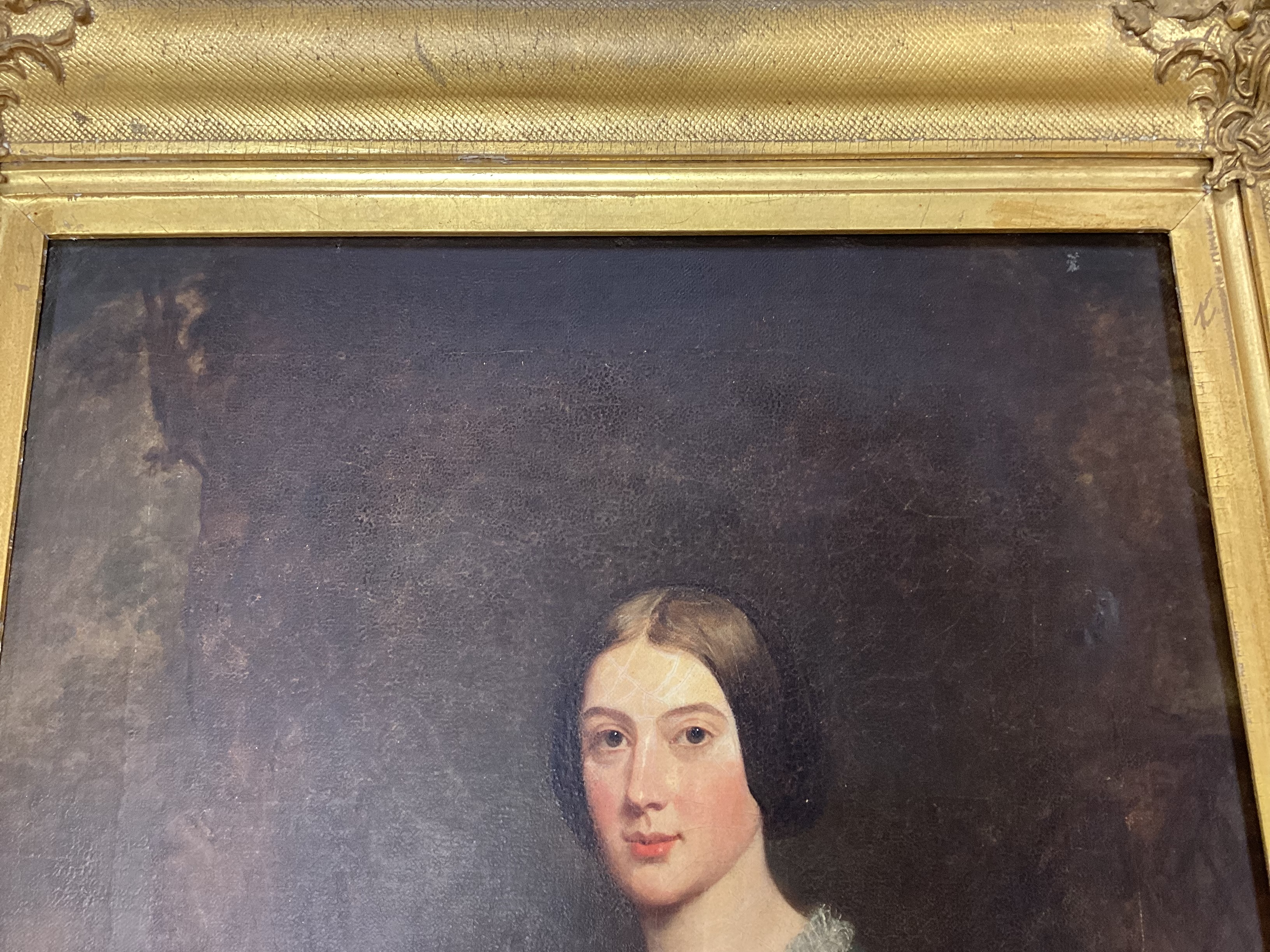 19th century English School, oil on canvas, Three quarter length portrait of a lady and her dog, 44 x 34cm, gilt framed